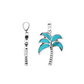 Vibrant sterling silver palm tree pendant with turquoise inlay and textured trunk, artisan-crafted for tropical beach style.